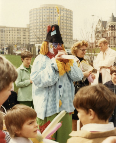 Often found dressed as Tumbleweed the Clown in a blue-and-white plaid shirt, white painted face and red nose, Naus would make balloons animals and tell jokes to the Marquette community. Photo courtesy of Marquette University Archives