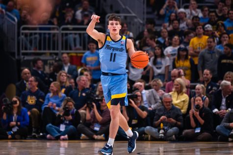Junior guard Tyler Kolek brings up the ball in No. 10 Marquette mens basketballs 80-77 overtime loss to Wisconsin Dec. 4 at Fiserv Forum. 
