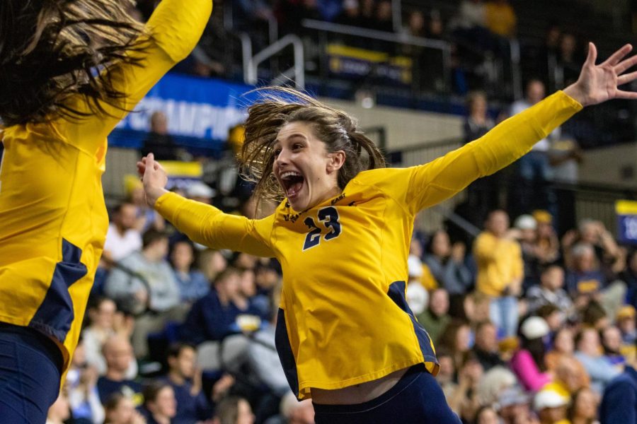 Sophomore defensive specialist Samantha Naber (23) celebrates from the sideline in Marquette volleyballs 3-0 win over Georgia Tech in the second round of the NCAA Volleyball Tournament Dec. 2. 