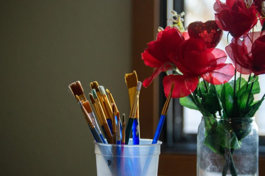 Self-care can range from eating a healthy meal to engaging in a relaxing hobby, such as painting.