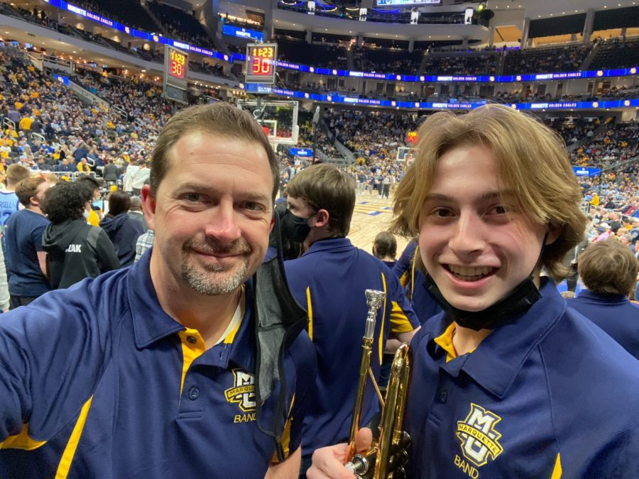 Charlie and his father, Paul, in the band section at a Marquette basketball game in Feb. 2022.