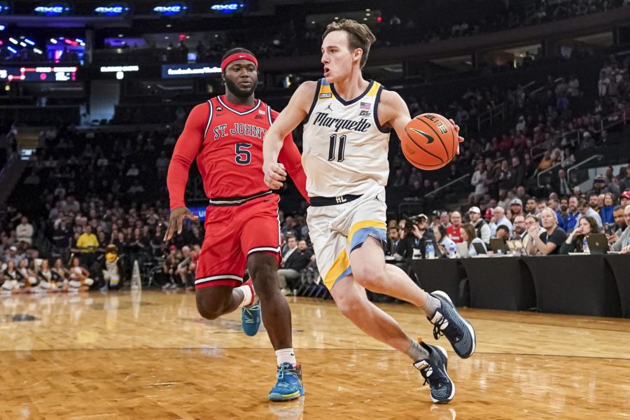Junior guard Tyler Kolek (11) finished with a near double-double in No. 6 Marquette mens basketballs 72-70 overtime win over St. Johns in the Big East Tournament quarterfinals. (Photo courtesy of Marquette Athletics.)