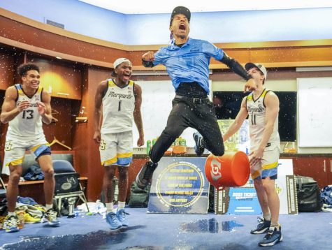 Marquette mens basketball head coach Shaka Smart celebrates in the locker room after the Golden Eagles win their first Big East Tournament title March 11, 2023 at Madison Square Garden. (Photo courtesy of Marquette Athletics.)