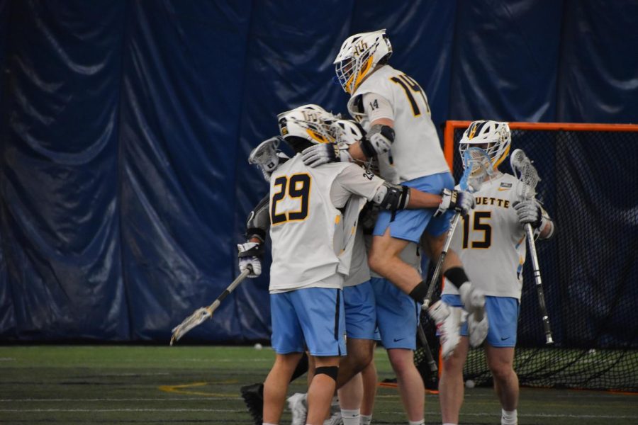 Marquette mens lacrosse celebrates after a goal in its 9-5 win over St. Bonaventure March 25 at Valley Fields. 