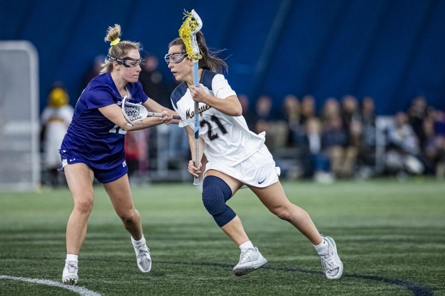 Shea Garcia (21) heads to net in Marquette womens lacrosses loss to then-No. 3 Northwestern back in February. (Photo courtesy of Marquette Athletics.)