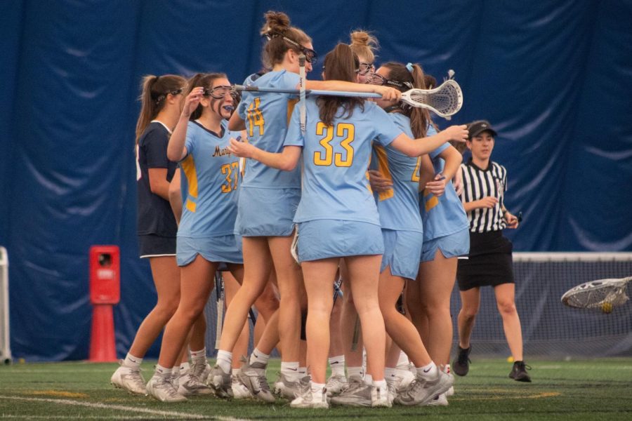 Marquette womens lacrosse celebrates during its ranked win April 15 against then-No. 24 UConn at Valley Fields.