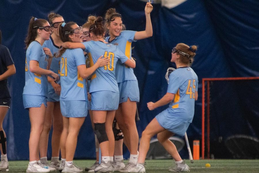 Marquette womens lacrosse celebrates its ranked win over No. 24 UConn April 15 at Valley Fields.