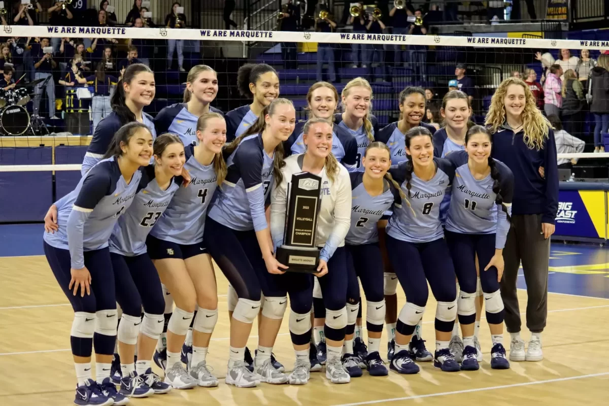 Marquette volleyball celebrates after winning its third consecutive Big East regular season title. (Photo courtesy of Marquette Athletics.)