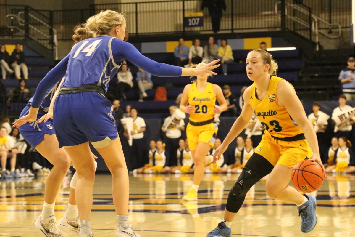 Jordan King dribbles the ball in No. 19 Marquettes win over No. 20 Creighton Wednesday night. 