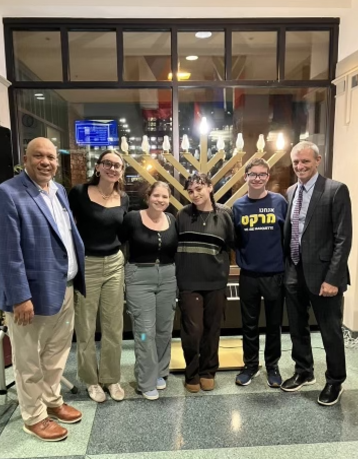 University Provost Kimo Ah Yun  and President Micheal Lovell pose with Students at the Menorah lighting event.

Photo courtesy of Marquette University Jewish Student Union. 