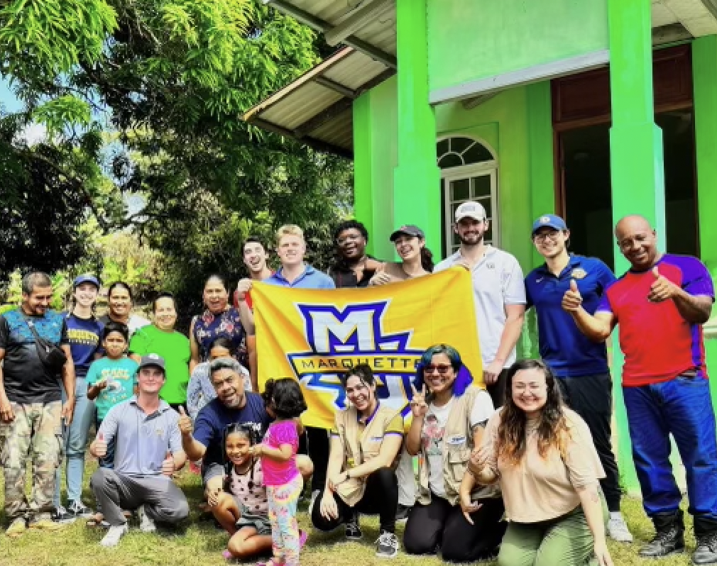 The Marquette Business Brigade with the community they served in Panama. 