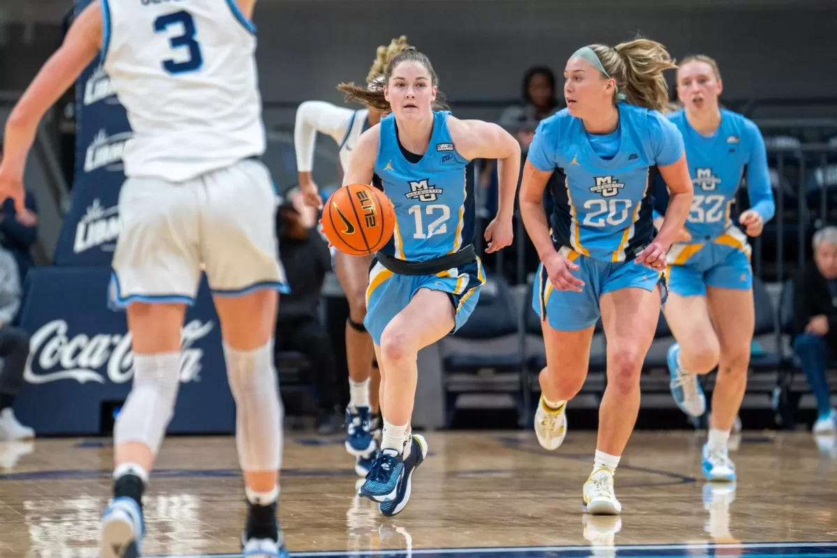 Sophomore guard Kenzie Hare (12) led Marquette with 21 points in a team-high 39 minutes. (Photo courtesy of Marquette Athletics.)