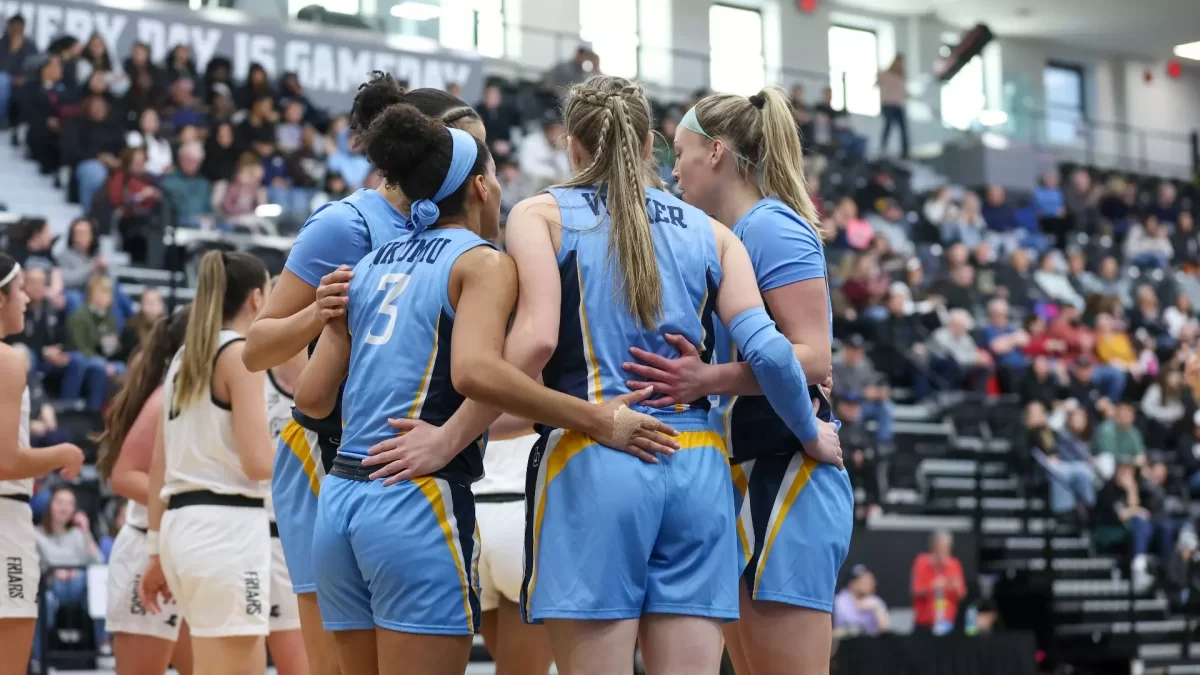 Marquette womens basketball huddles during its 66-62 win over Providence. (Photo courtesy of Marquette Athletics.)