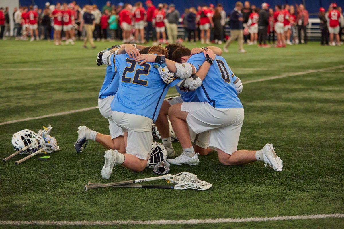 Some+Marquette+mens+lacrosse+players+huddle+during+its+game+against+Utah.+%28Photo+courtesy+of+Marquette+Athletics.%29
