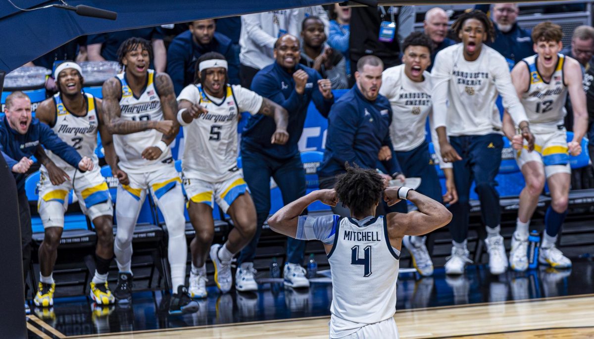 Stevie Mitchell flexes after an and-one layup in Marquettes 87-69 win over Western Kentucky. (Photo courtesy of Marquette Athletics.)