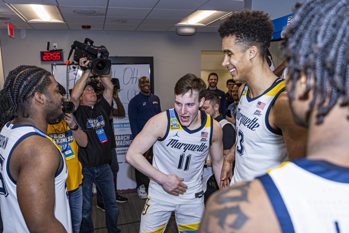 Tyler Kolek celebrates with his team after advancing to the Sweet 16 of the NCAA Tournament. (Photo courtesy of Marquette Athletics.)