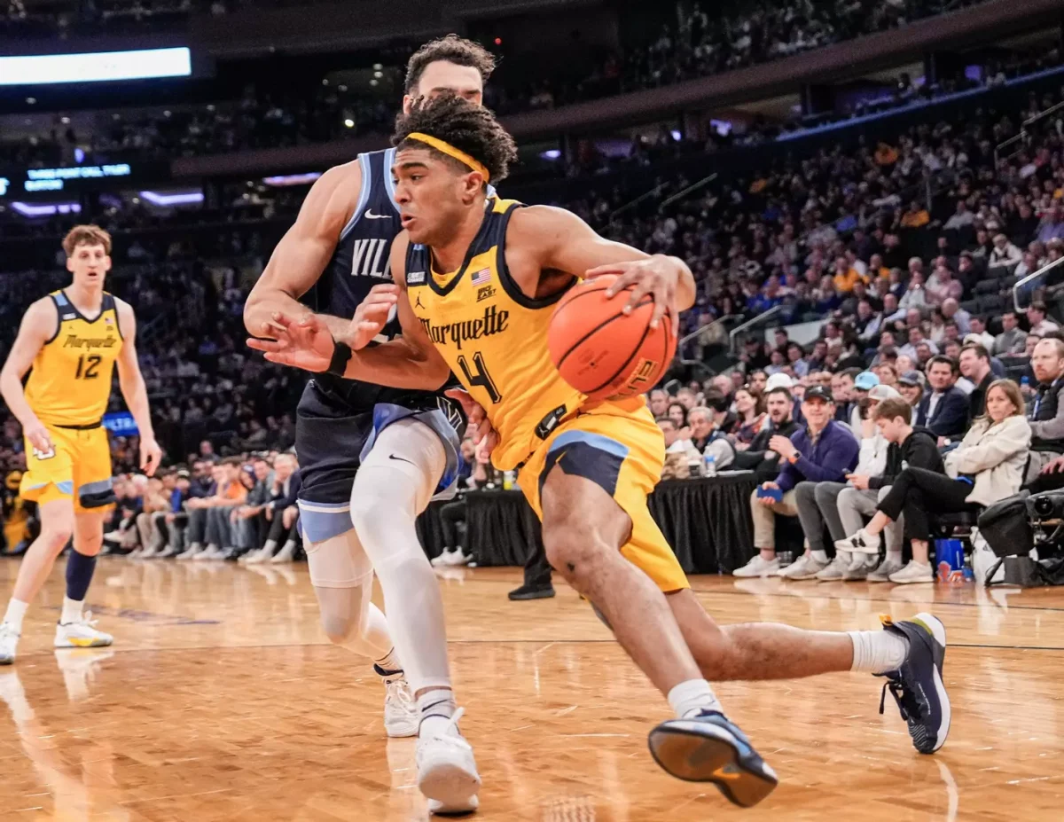 Stevie Mitchell drives to the hoop in Marquettes 71-65 win over Villanova. He finished with 15 points. (Photo courtesy of Marquette Athletics.)