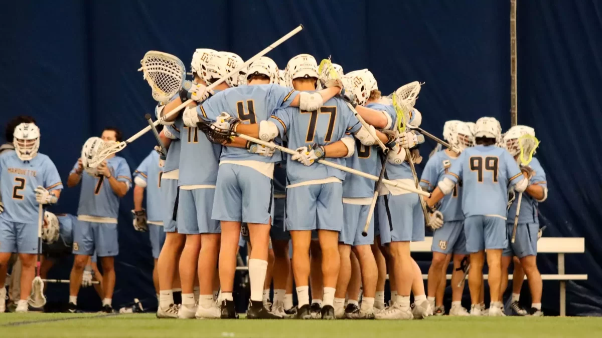 Marquette huddles in its 16-5 win over Lindenwood Feb. 9. (Photo courtesy of Marquette Athletics.)