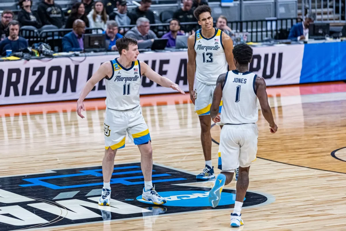 Marquette mens basketball celebrates in its 87-69 win over Western Kentucky. (Photo courtesy of Marquette Athletics.)