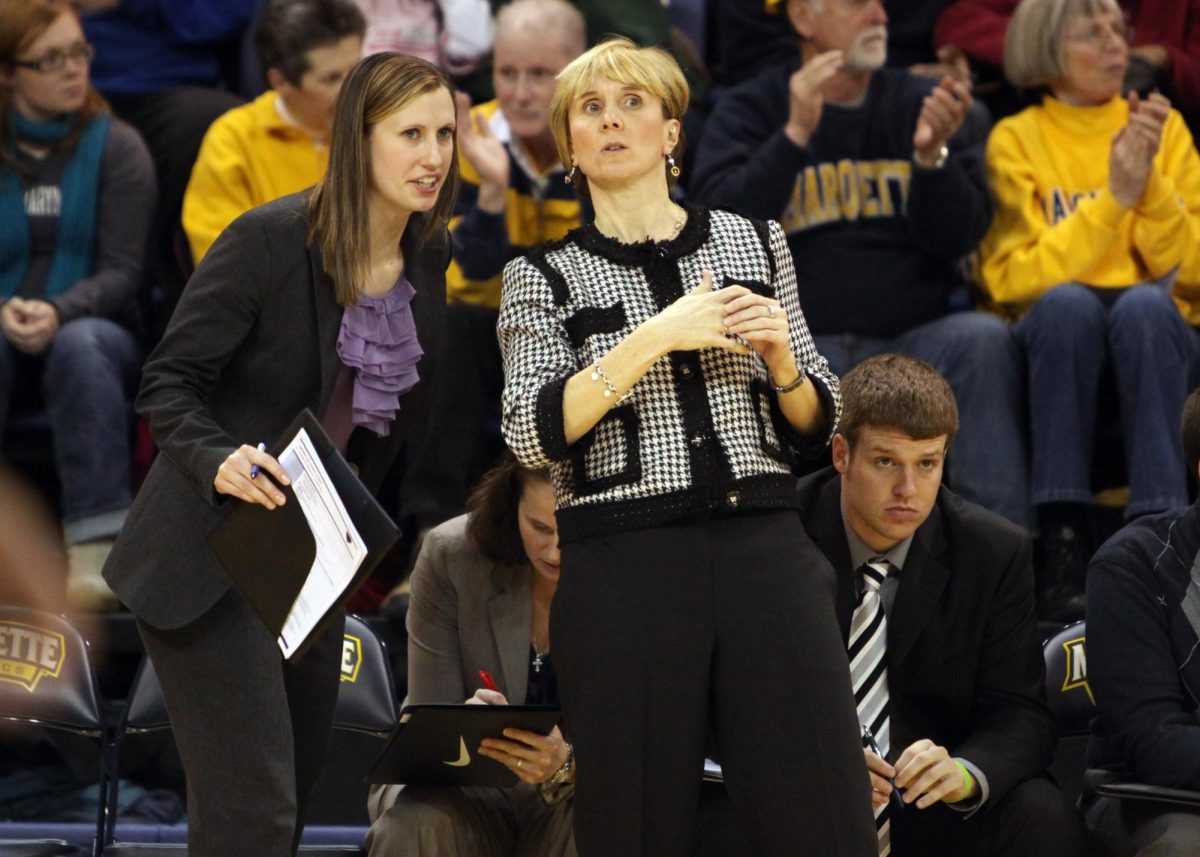 Cara Consuegra (left) was an assistant at Marquette for seven years under head coach Terri Mitchell. (Photo courtesy of Marquette Athletics.)