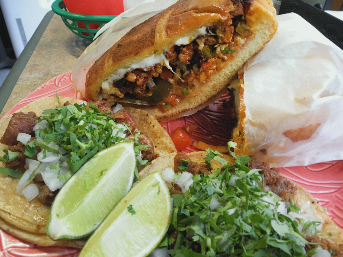 La Chinampa's al pastor torta is piled high with juicy pork and fresh vegetables.