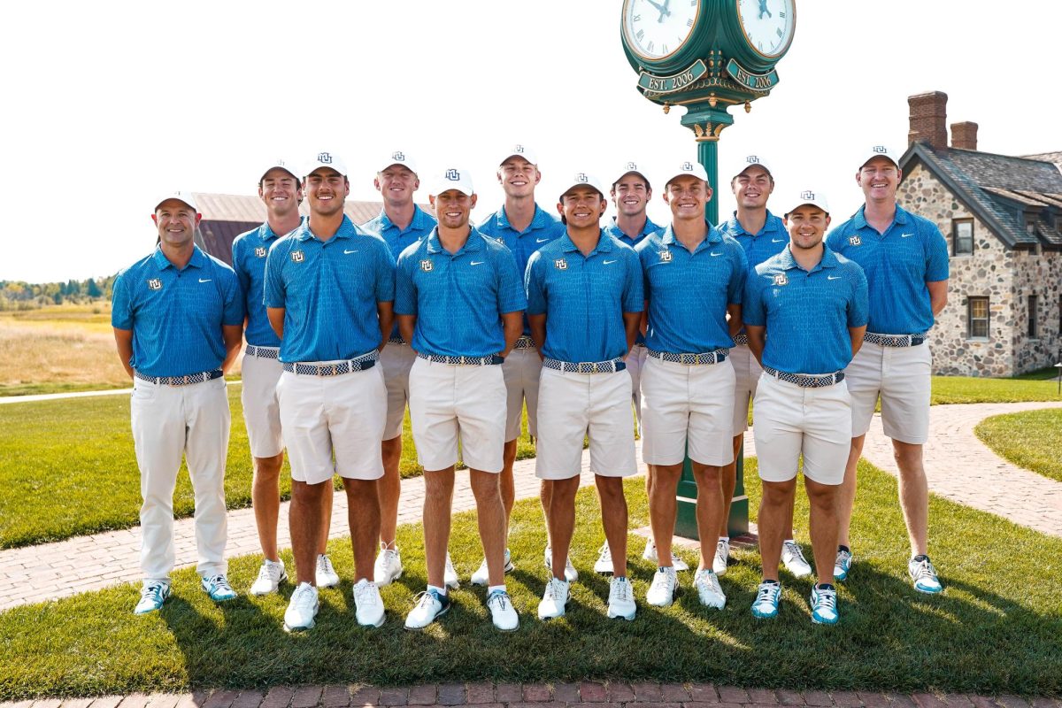 Jordan Niebrugge (Pictured far right) joined Marquette as an assistant coach in June. (Photo courtesy of Marquette Athletics.)