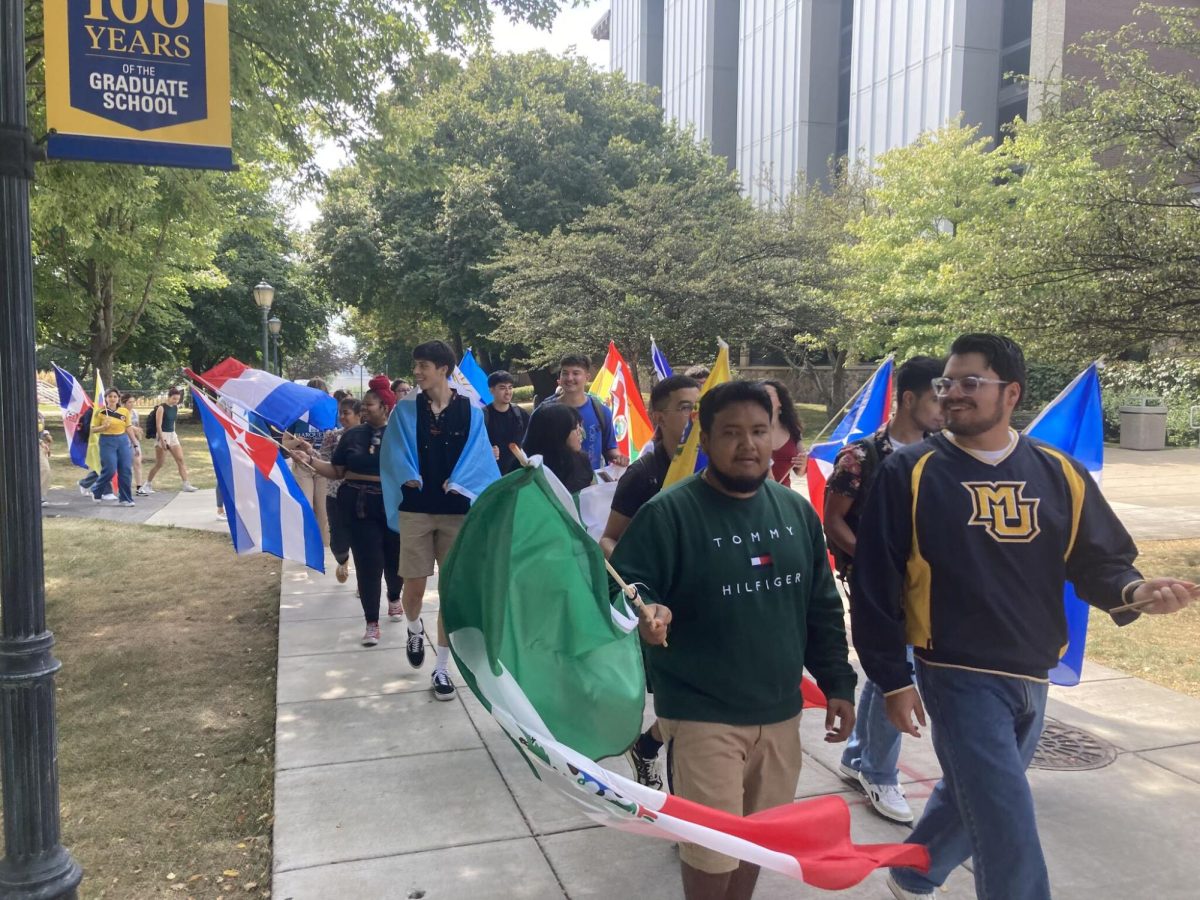 The Marquette Mile was graced with a myriad of colors as students marched with flags that recognized each Latin American country. Photo courtesy of Jacki Black.