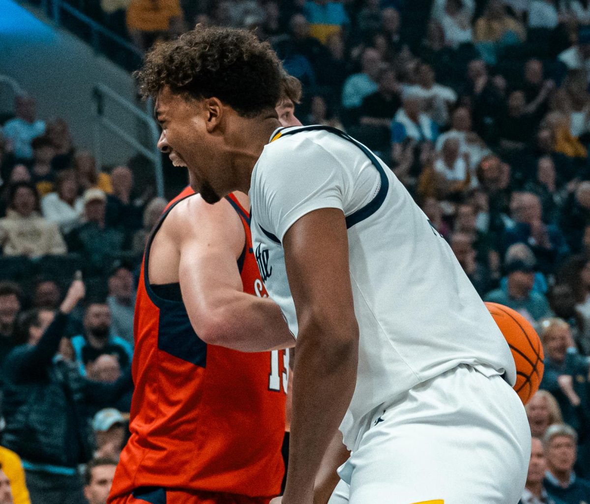 First-year forward Royce Parham tallied six points and three rebounds in 12 minutes Monday night in his debut for Marquette. (Photo courtesy of Marquette Athletics.)