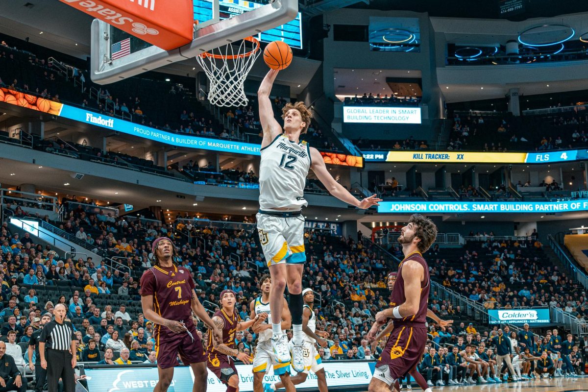 Ben Gold throws down a dunk Monday, Nov. 11 in Marquette men's basketball's 70-62 win over Central Michigan. (Photo courtesy of Marquette Athletics.)