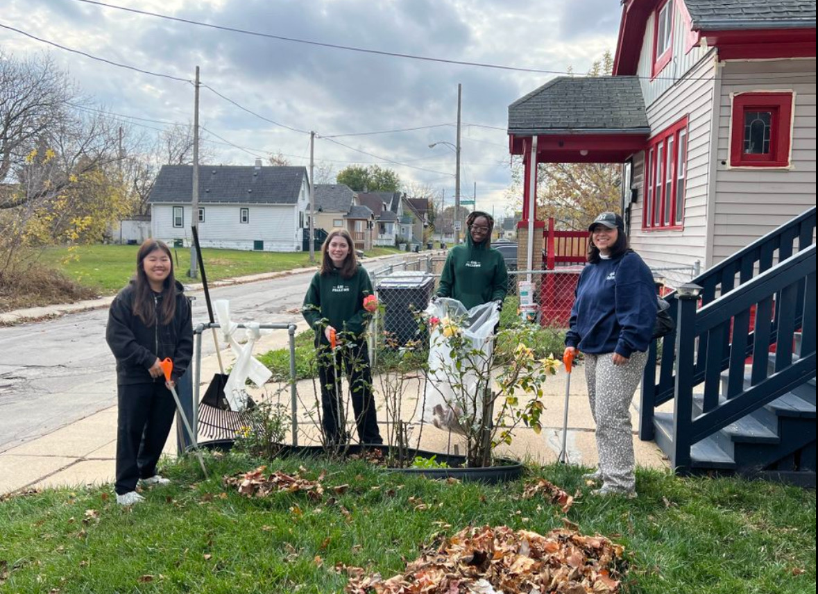 Arrupe Center employees helping out elders in the community prepare their homes for winter.