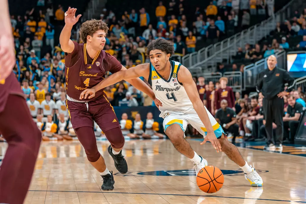 Stevie Mitchell (right) is guarded by 
Kyler VanderJagt (left) during Marquette's 70-62 win on Nov. 11, 2024.

