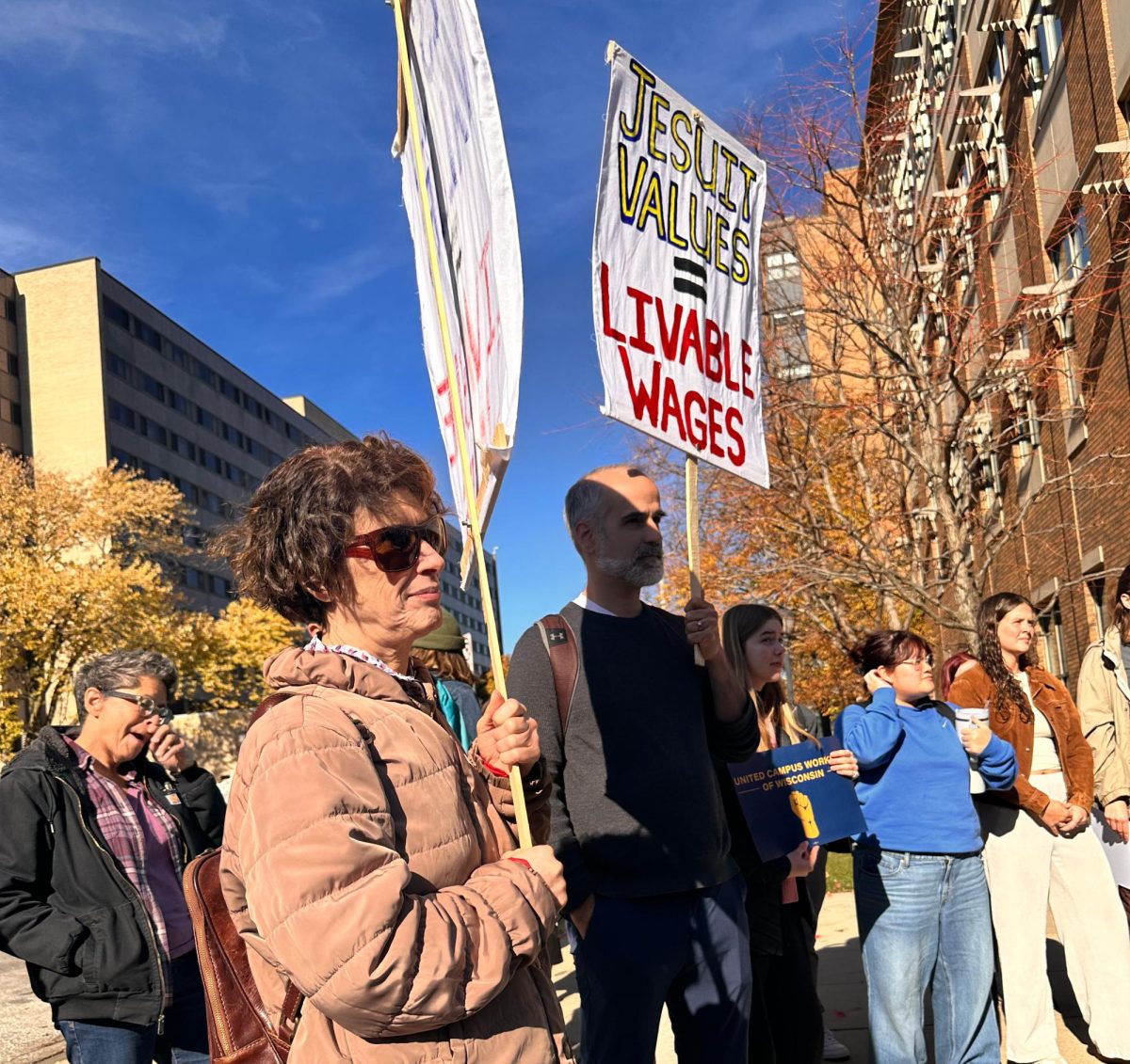 Students and faculty demonstrate outside Zilber Hall.