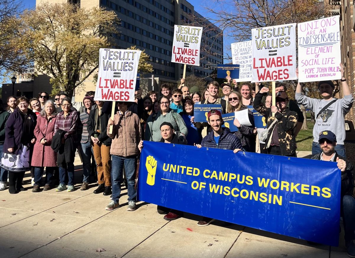 Marquette students and faculty held signs and gave speeches outside of Zilber Hall advocating for the necessity of a union.