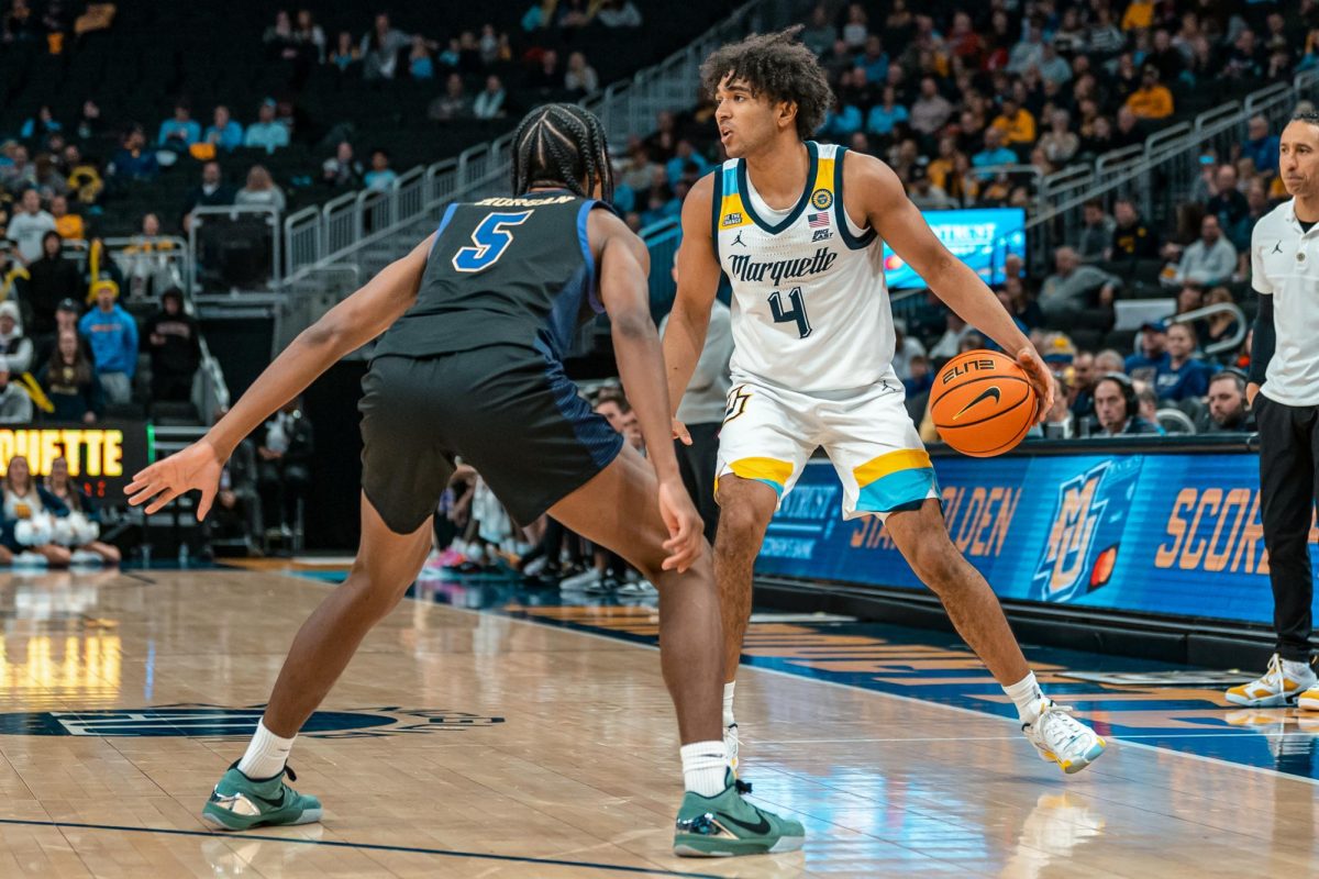 Stevie Mitchell (right) is tied for 16th in the country in steals per game, averaging 2.75 (Photo courtesy of Marquette Athletics).