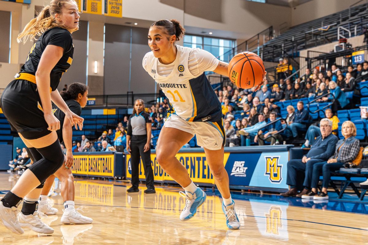 Skylar Forbes (right) tallied her second double-double of the season Saturday, Dec. 21 in Marquette's 87-42 win over Stonehill.