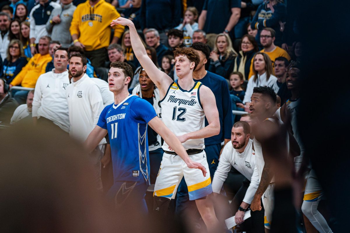 Ben Gold (right) shoots over Ryan Kalkbrenner (left) in Marquette's 72-67 win over Creighton on Dec. 30, 2023.