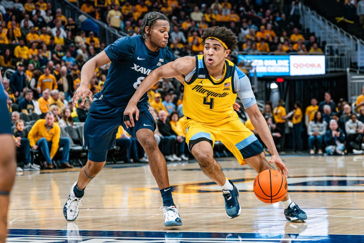 Stevie Mitchell (4) drives to the basket in Marquette's 88-64 win over Xavier last season on Feb. 25, 2024 at Fiserv Forum.