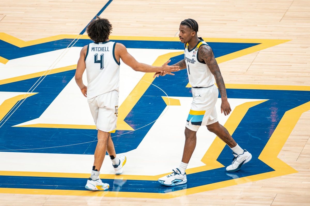 Seniors Kam Jones and Stevie Mitchell combined for 40 points in No. 8 Marquette's 79-71 victory over Creighton Friday night. (Photo courtesy of Marquette Athletics.)