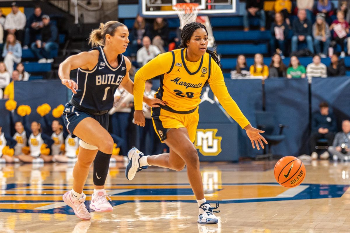 Marquette's Olivia Porter (right) drives to the basket during Marquette's 57-54 win over Butler at the Al McGuire Center on Saturday, Jan. 4.