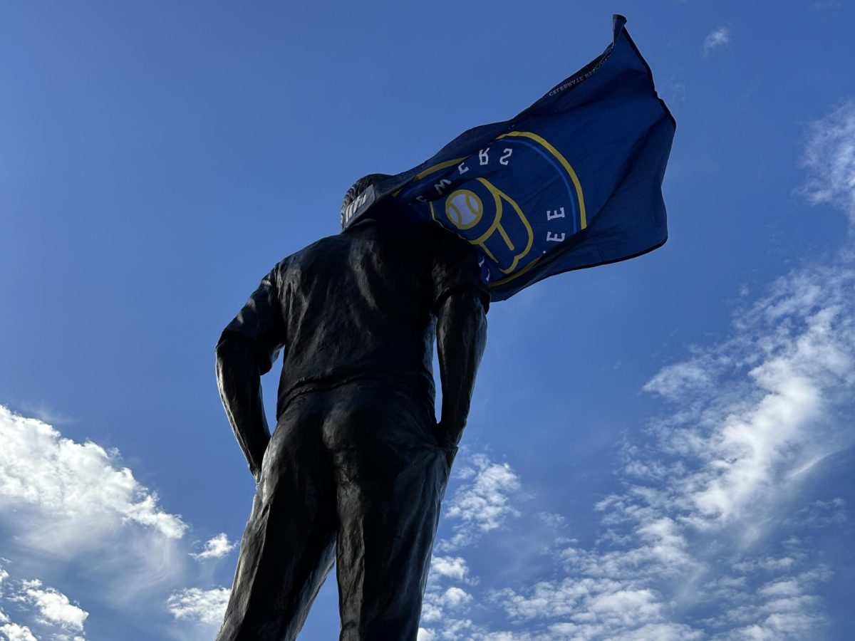 A Brewers flag was wrapped around the Uecker statue, positioned to look like a superhero cape.