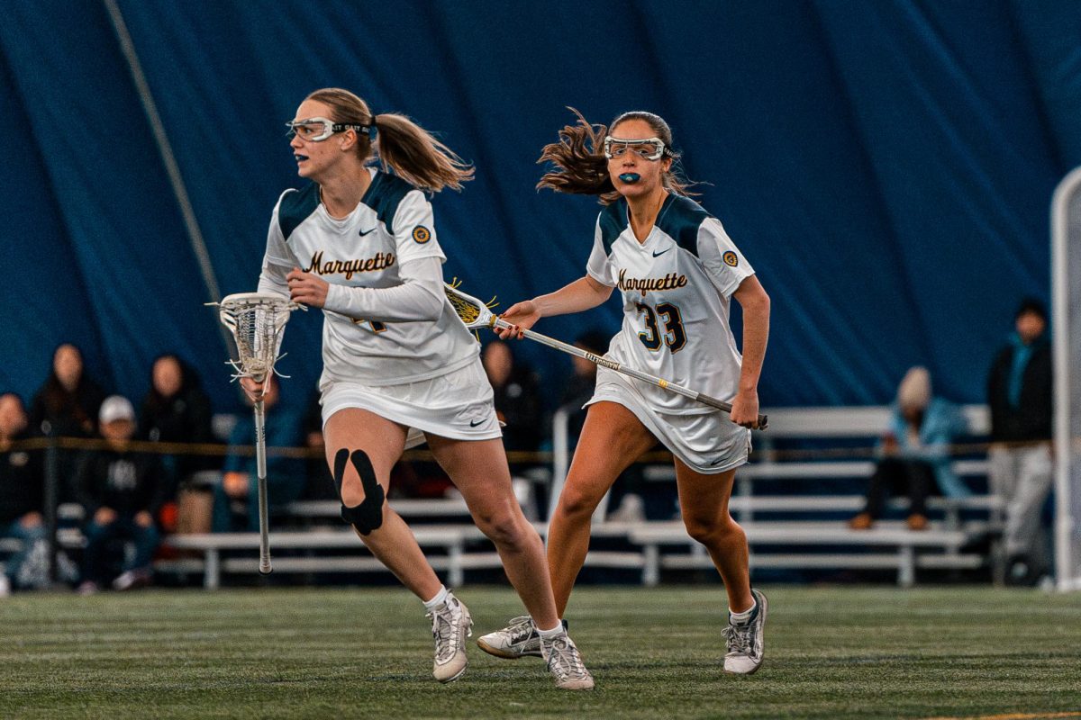 Meg Bireley (33) nets five goals as Marquette downs Louisville 13-10 Monday at Valley Fields.