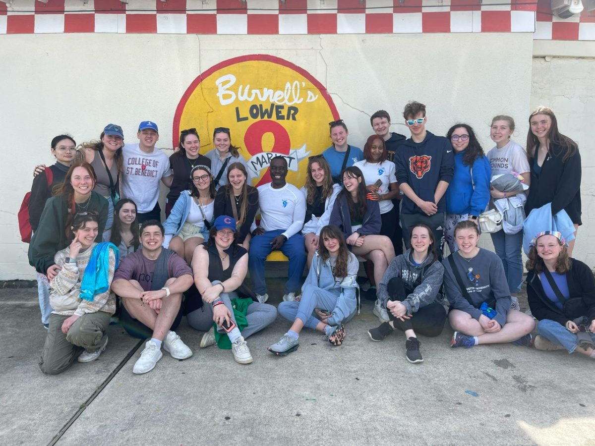 Members of the spring 2024 New Orleans trip visit Burnell, the owner of the only grocery store in the Lower Ninth Ward neighborhood. Photo courtesy of Kyla Schwager.