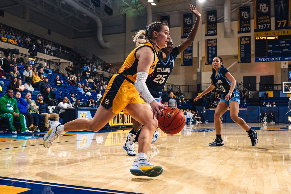 Senior guard Lee Volker (right) scored a season-low three points in Marquette's 73-66 loss in the quarterfinals of the Big East Tournament.