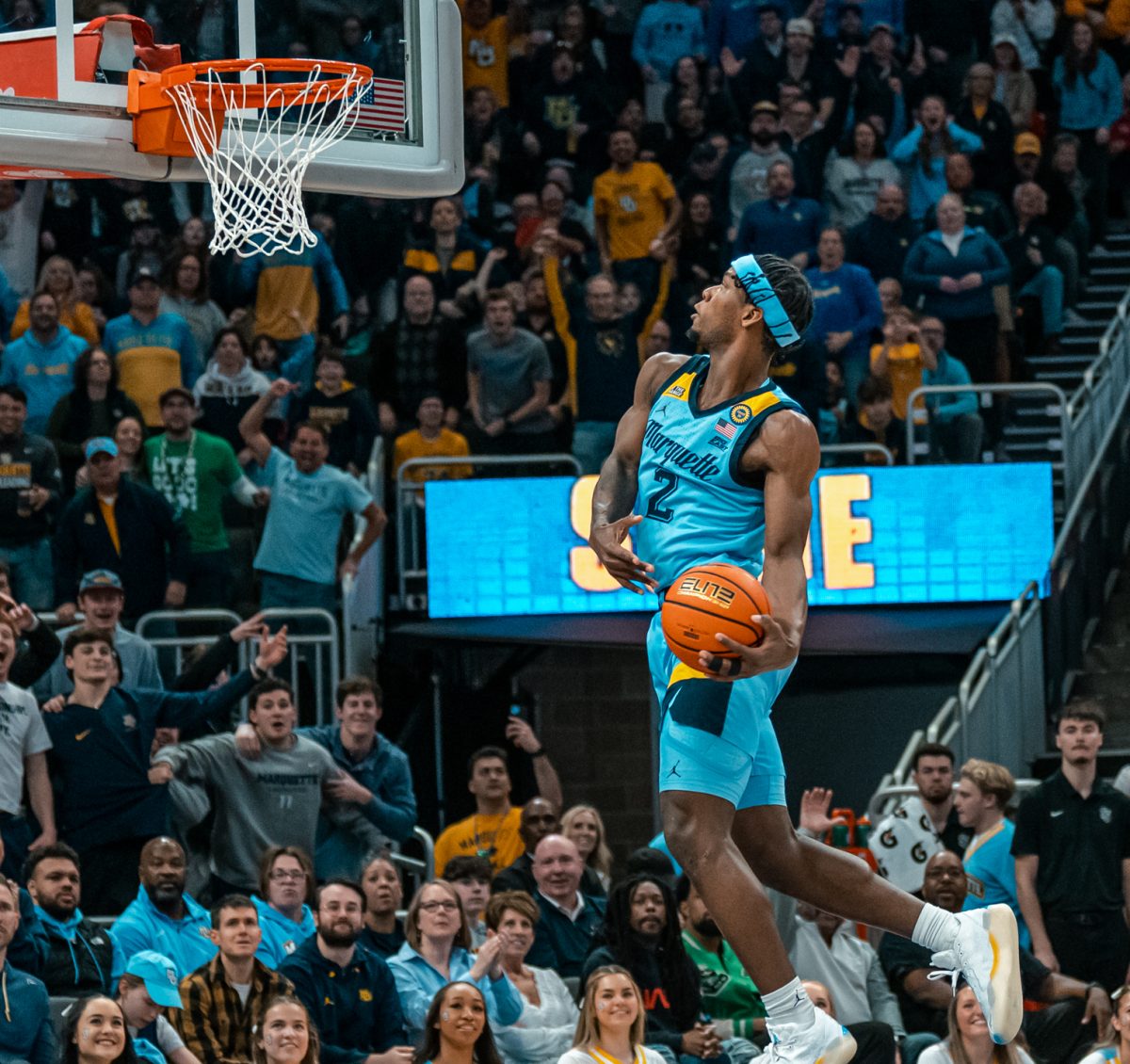 Chase Ross throws down a windmill dunk Saturday during Marquette's 86-84 loss to No. 6 St. John's.