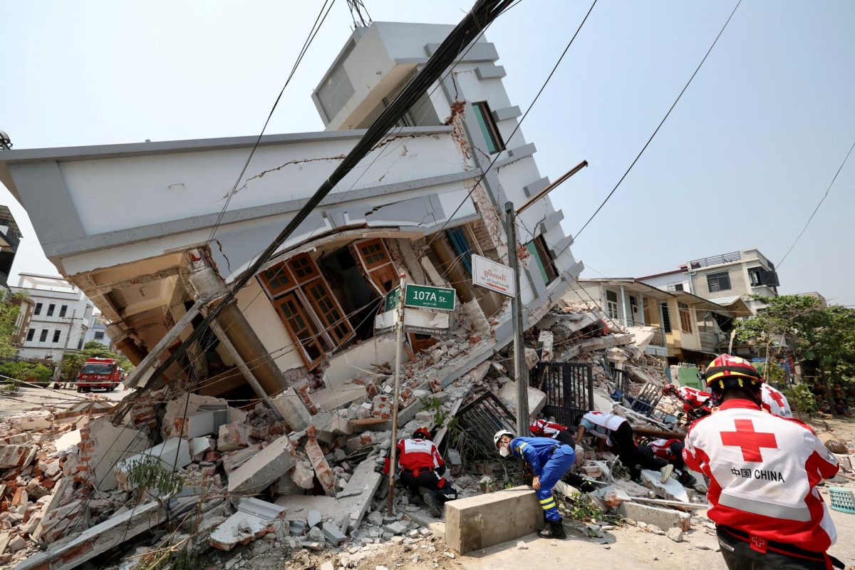 Members of the Chinese Red Cross International Emergency Response Team work at a collapsed residential building following the earthquake, in Mandalay, Myanmar March 31, 2025. China Daily via REUTERS