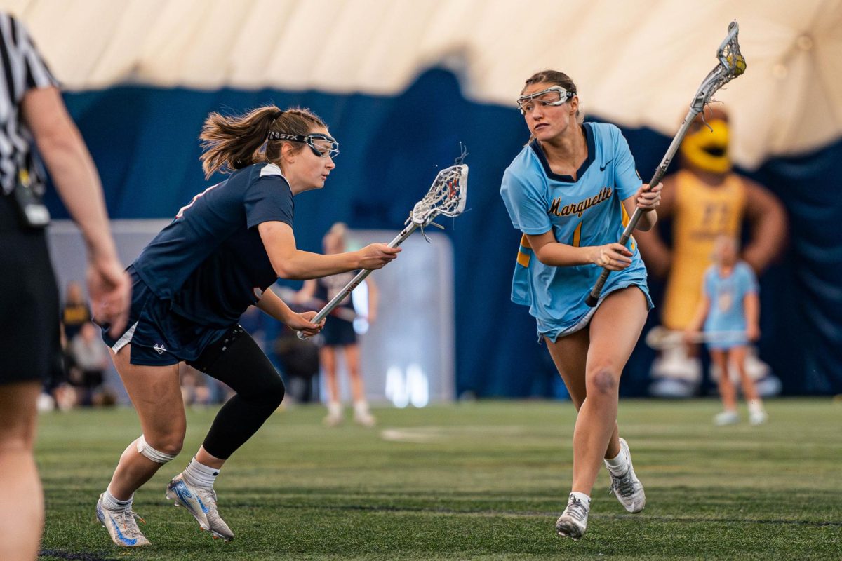 Junior attacker Tess Osburn (right) netted a career-high six goals in the loss.