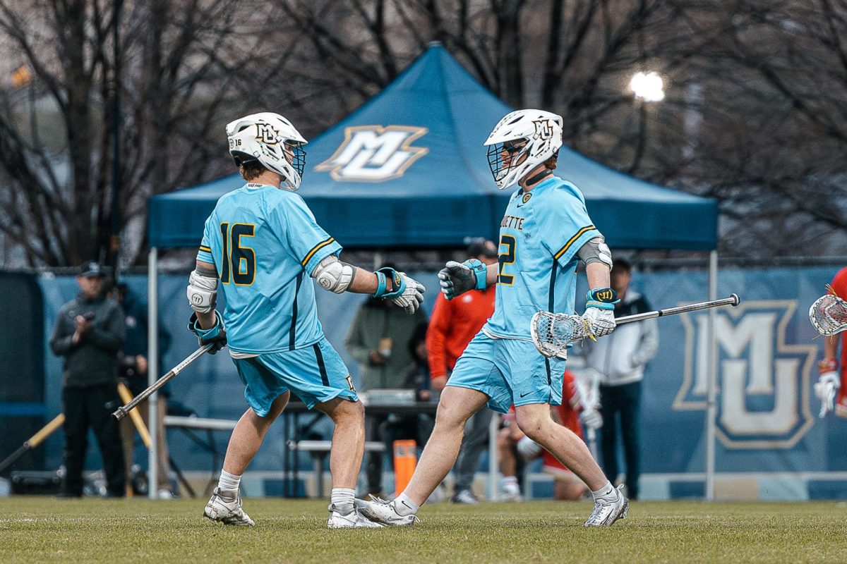 Senior attacker Nolan Rappis (left) and senior midfielder Will Foster (right) scored a combined eight goals in Marquette's 18-11 win over Denver April 25.