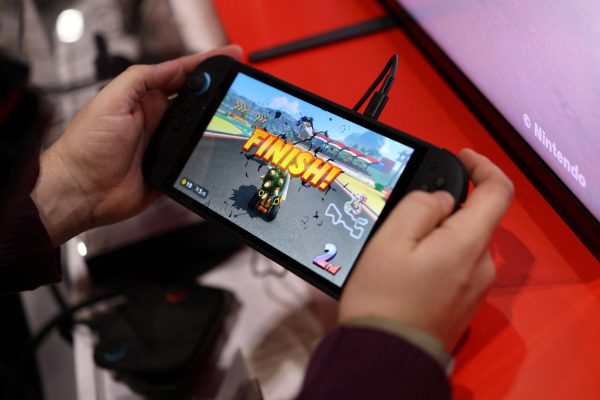 An attendee plays Mario Kart World by Nintendo Switch 2 during the Nintendo Switch 2 Experience at the ExCeL London international exhibition and convention centre in London, Britain, April 11, 2025. REUTERS/Isabel Infantes
