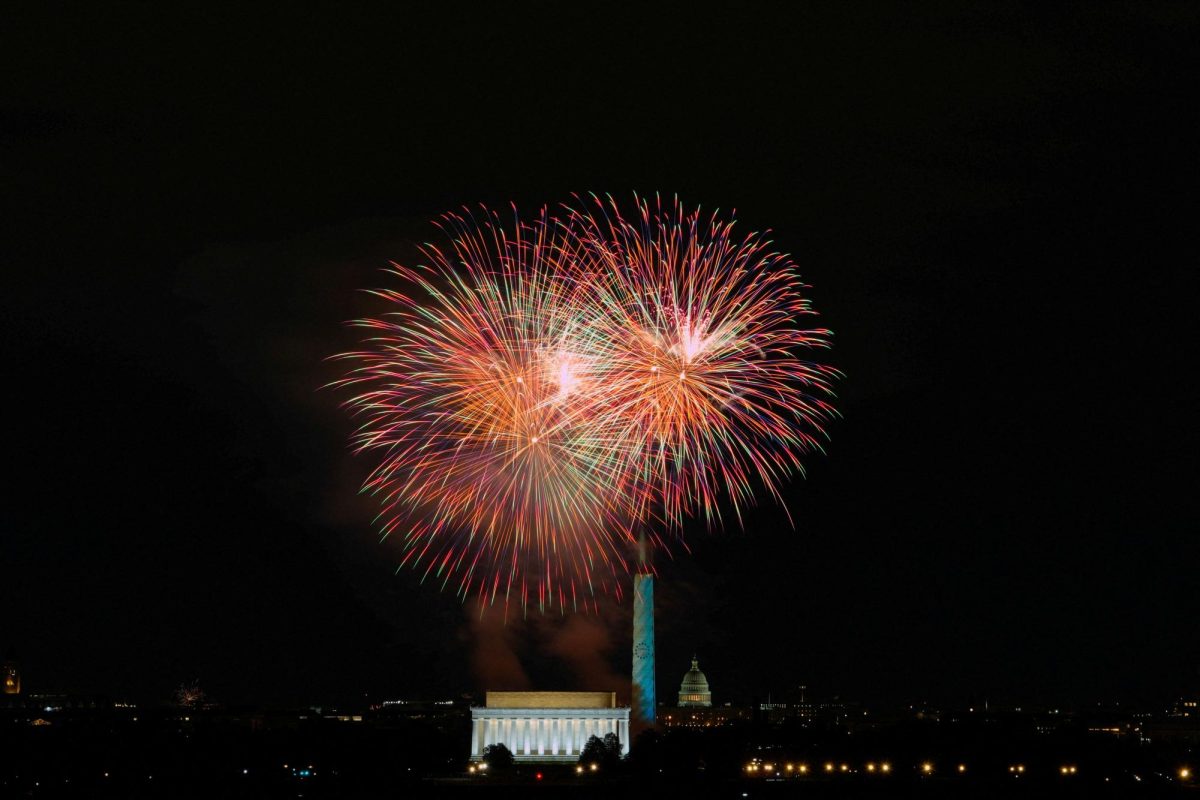 Fireworks explode over the Washington Monument, illuminated as part of the U.S.'s 250th anniversary celebrations, in Washington, D.C., U.S. January 1, 2026. REUTERS/Kent Nishimura