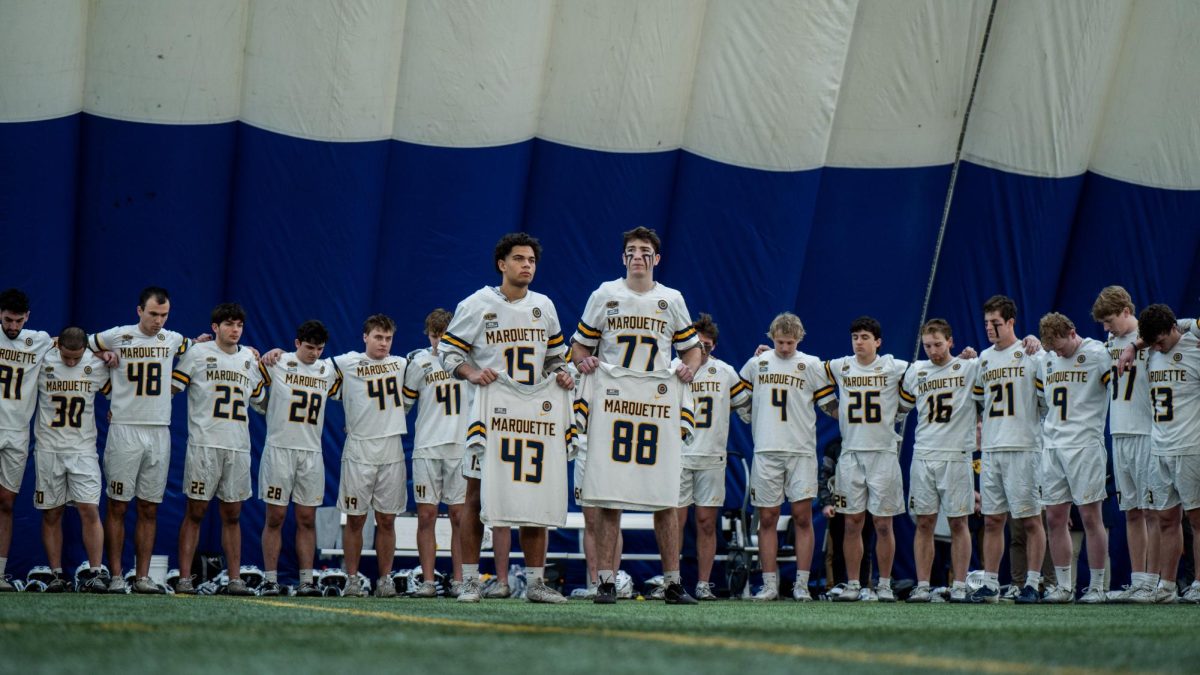Marquette men's lacrosse honored fallen teammates Noah Snyder (No. 43) and Scott Michaud (No. 88) in first game since their deaths.